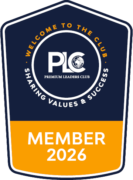 Abzeichen des Premium Leaders Club mit der Aufschrift "Mitglied 2026" und dem Motto "Werte und Erfolg teilen".